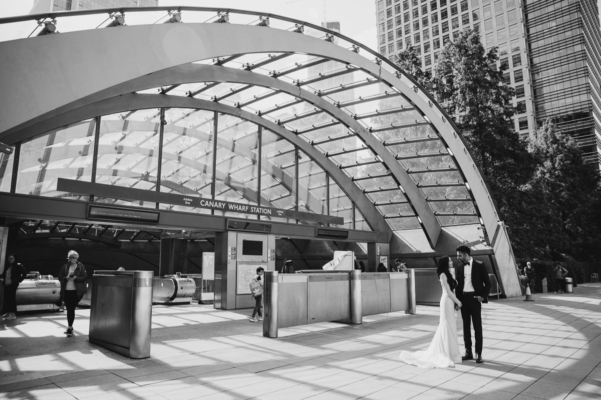 COUPLE HUGGING FOR THEIR CANARY WHARF ENGAGEMENT PHOTOSHOOT, LONDON WEDDING PHOTOGRAPHER