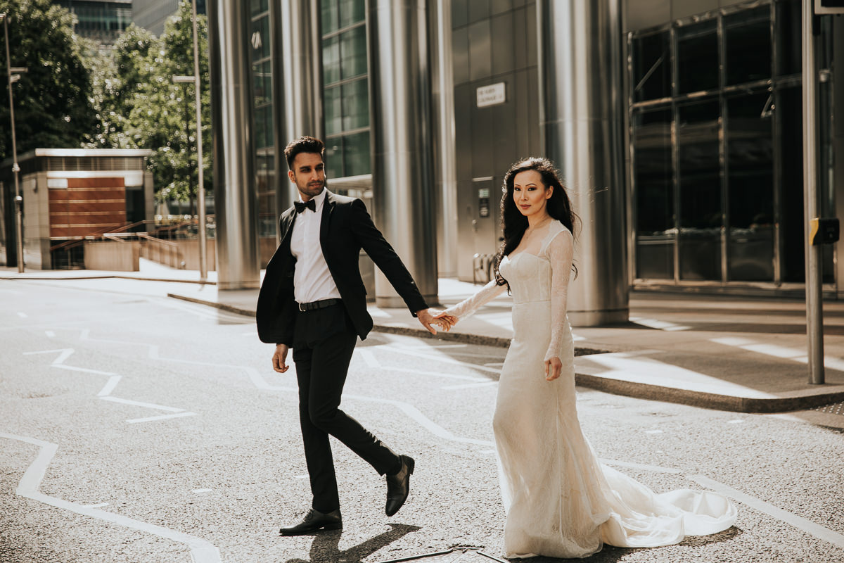 COUPLE HUGGING FOR THEIR CANARY WHARF ENGAGEMENT PHOTOSHOOT, LONDON WEDDING PHOTOGRAPHER