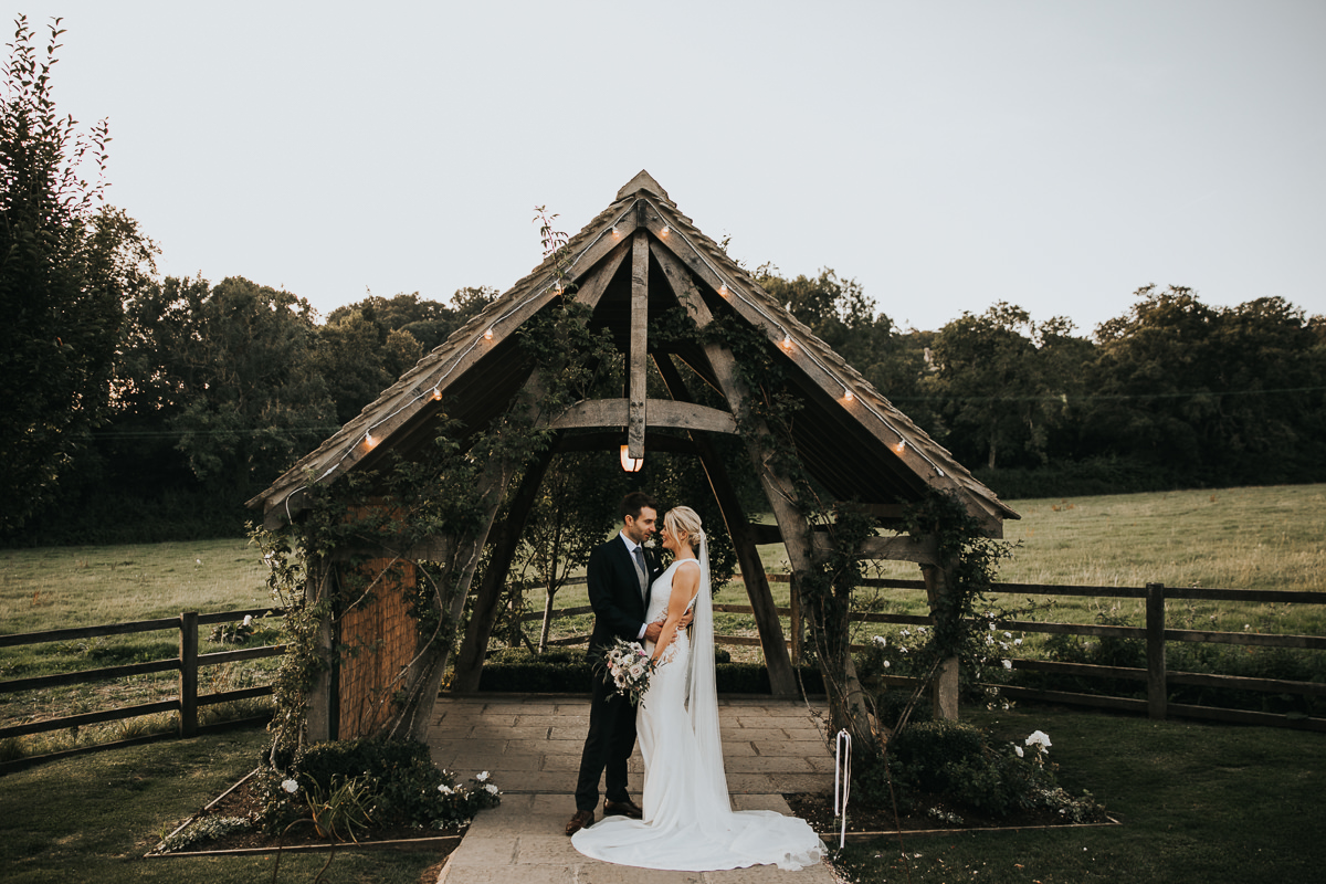 Hyde house wedding photography cotswolds, bride and groom having photographs